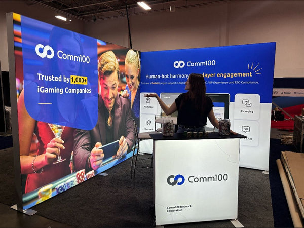 Comm100 - Corner booth setup with tension fabric displays